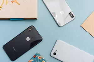 Several smartphones laid out on a table